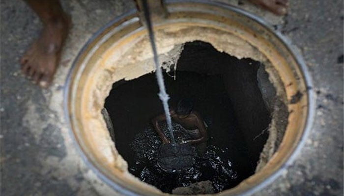 two sewer workers