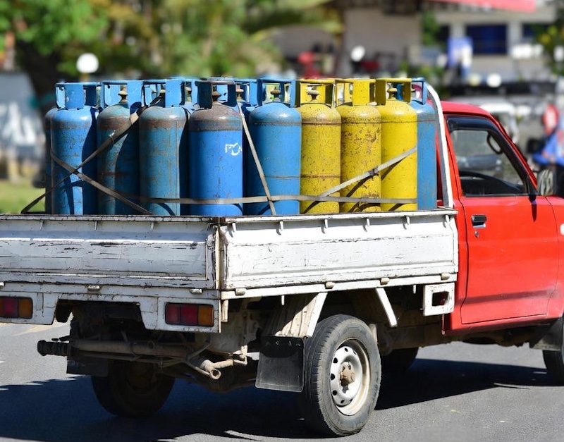 gasladen pickup overturns