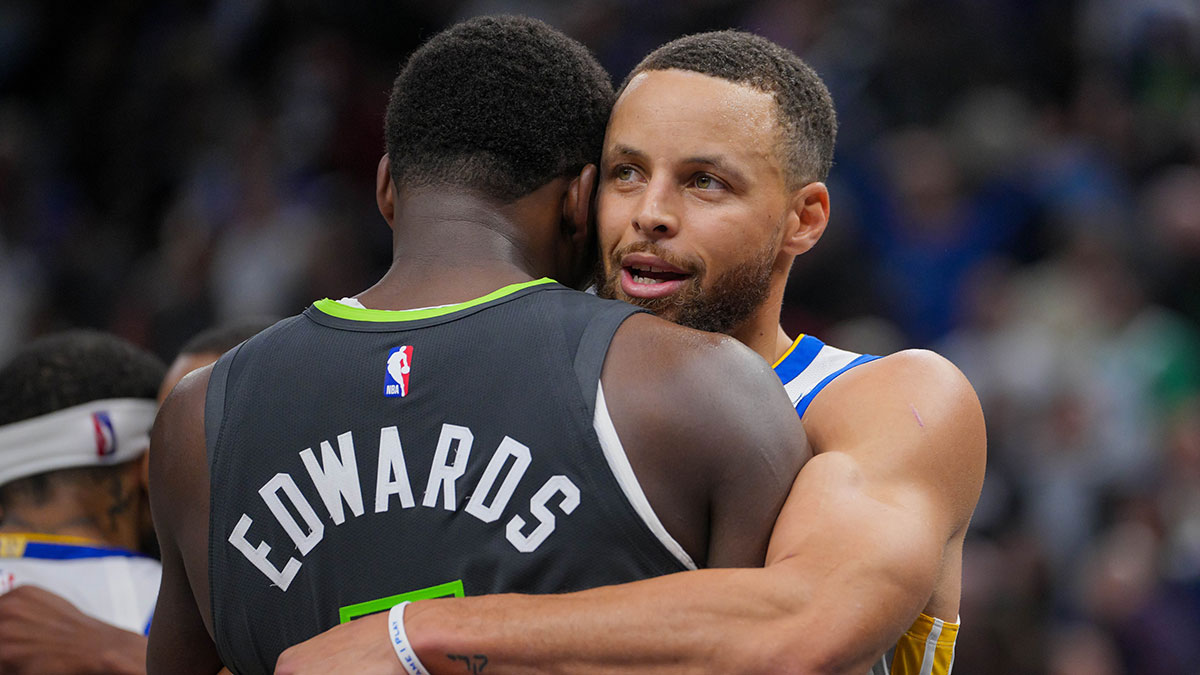 Warriors Stephen Curry embraces Timberwolves Anthony Edwards.jpg