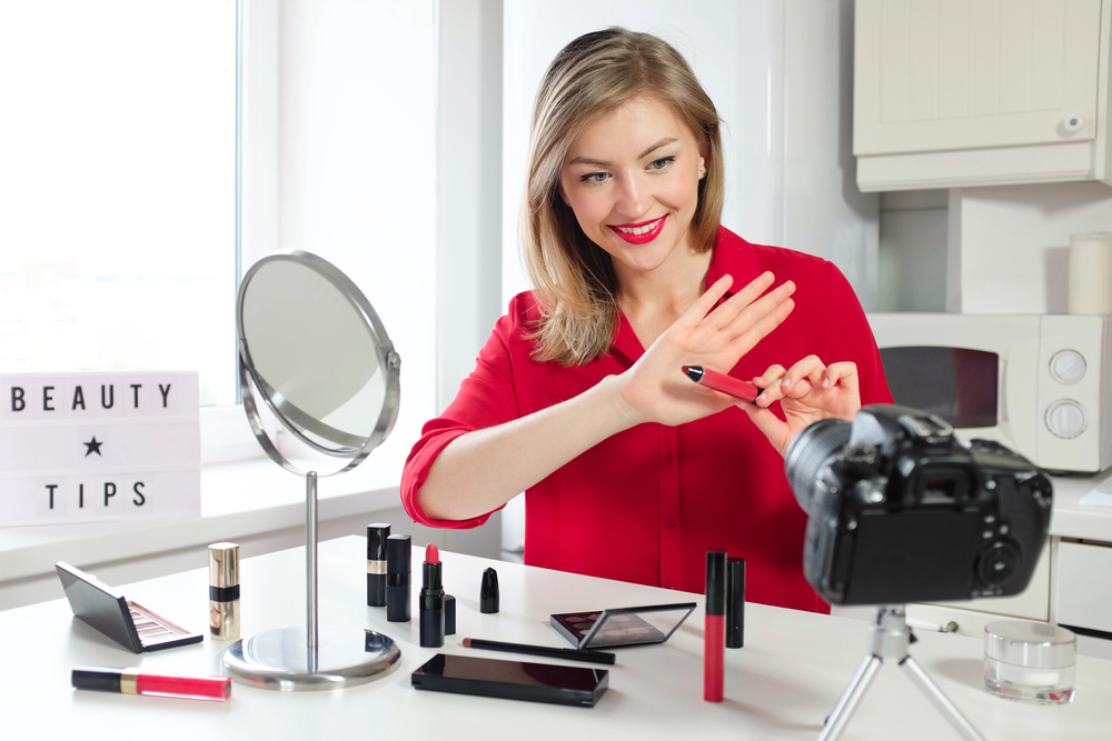 Beauty influencer filming beauty tips for social media.png