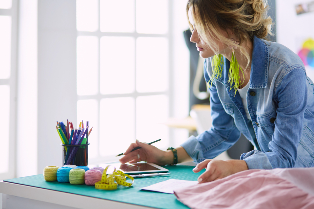 Fashion designer working her creative business from home.png