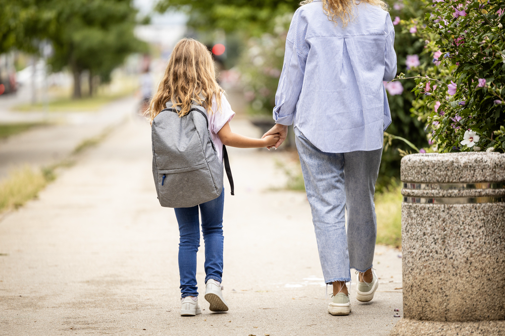 Mom walking daughter to school for blog post jobs during school hours.png