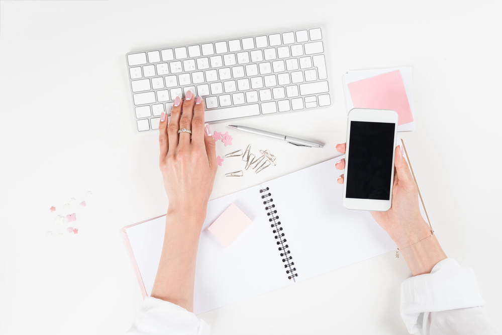 Woman taking surveys from Survey Junkie on her smartphone.png