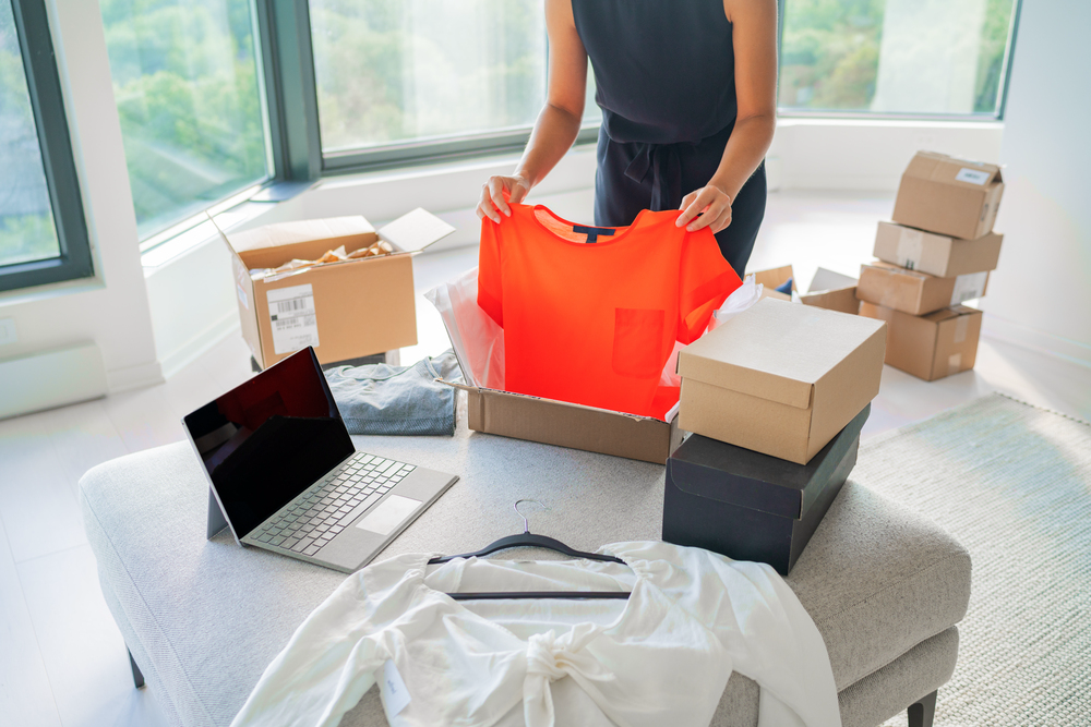 Woman using online consignment shops to sell clothing.png