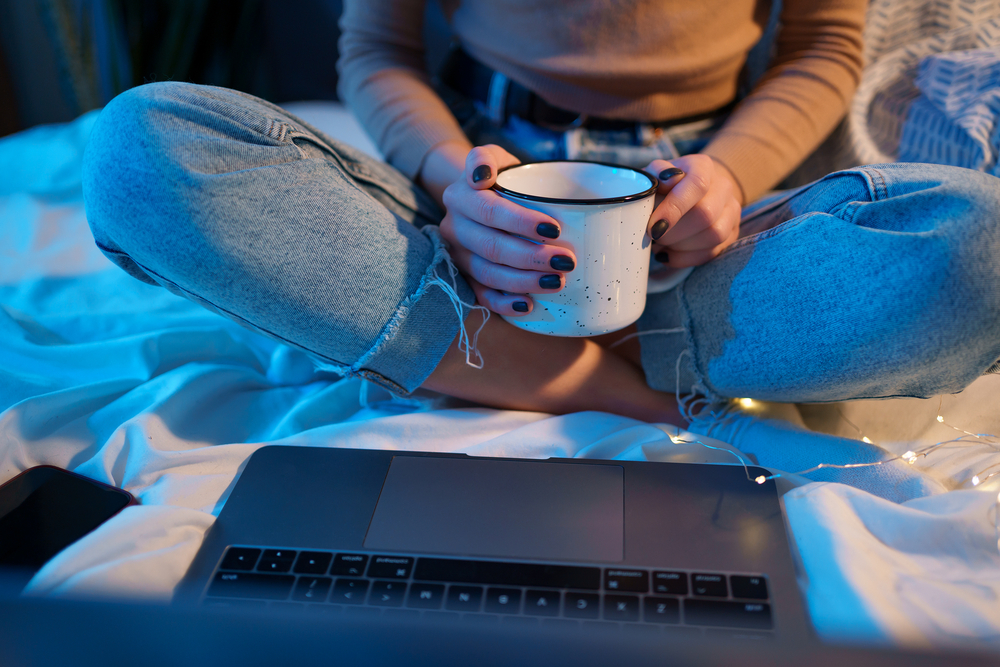 Woman working her work from home jobs with flexible hours at night.png