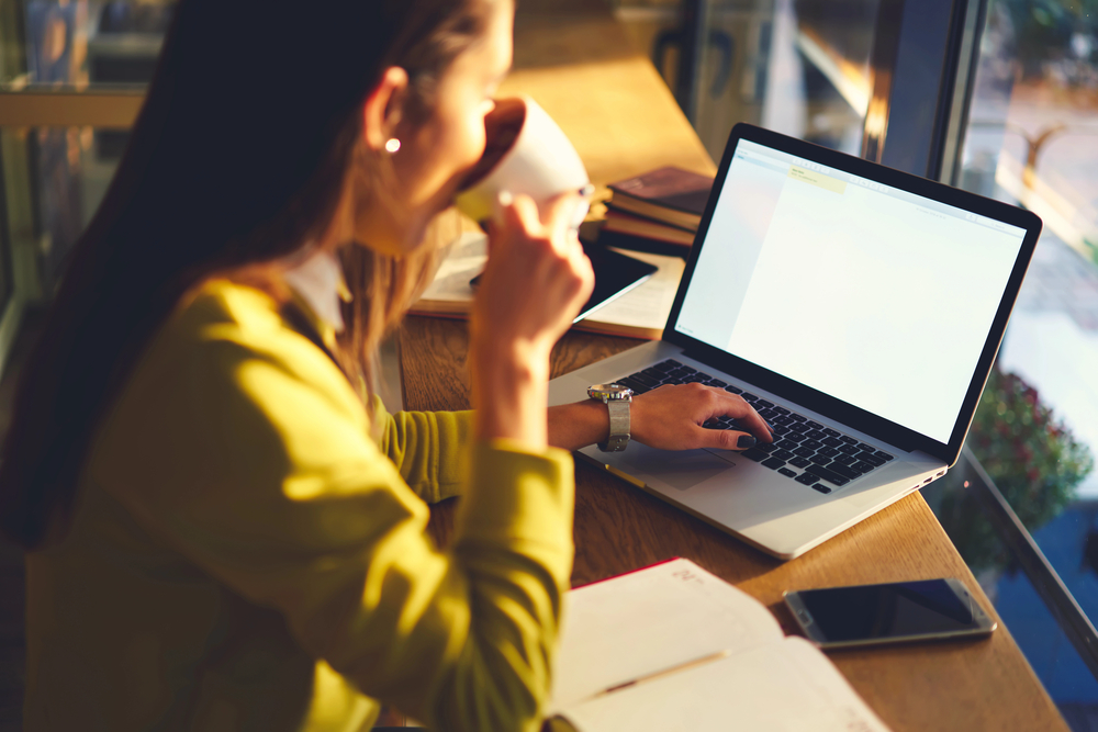 Young female doing online research for work at home companies with an A rating with the BBB.png