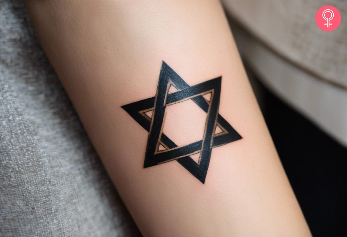 A Hebrew Star Of David tattoo on a womans forearm.jpg