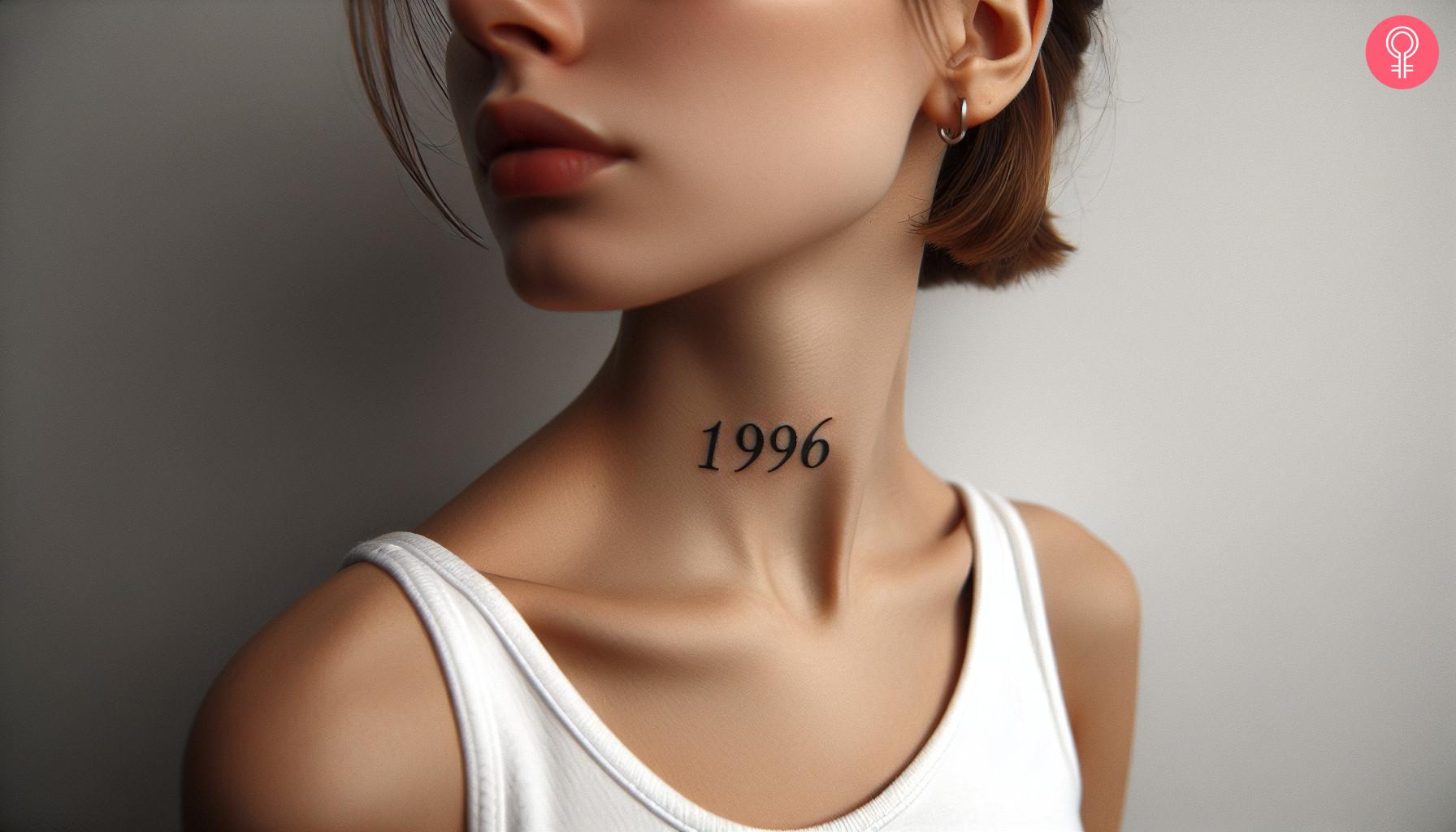 A minimalist 1996 tattoo inked on the neck.jpg