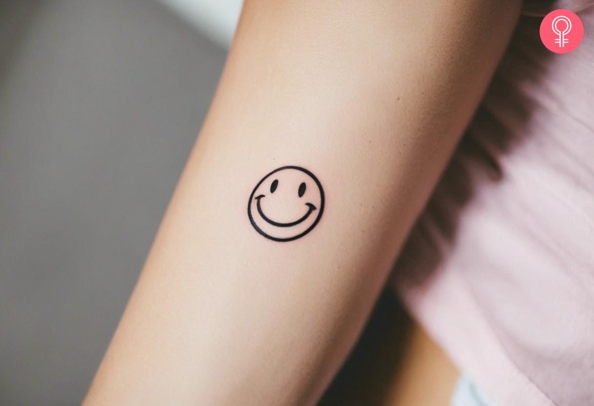 A minimalist smiley face doodle tattoo.jpg