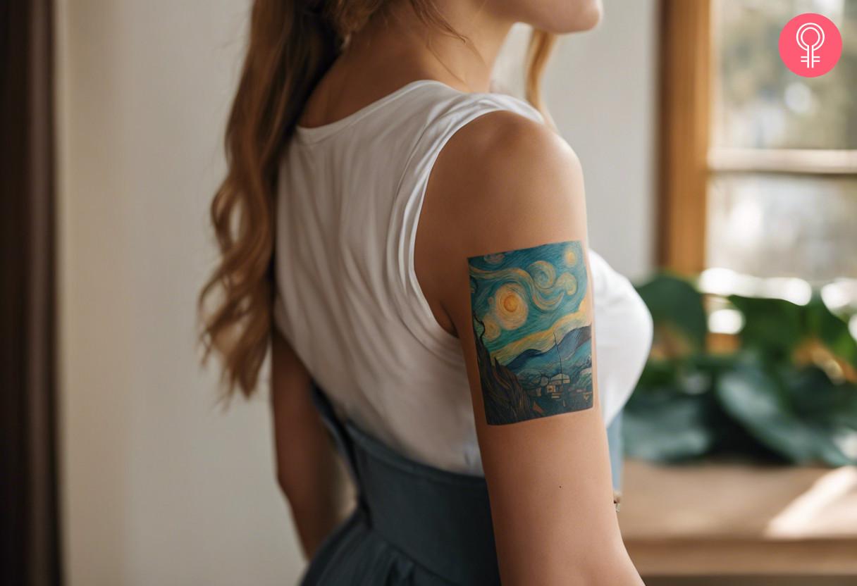 A small rectangular tattoo of Starry Nights on the upper arm.jpg