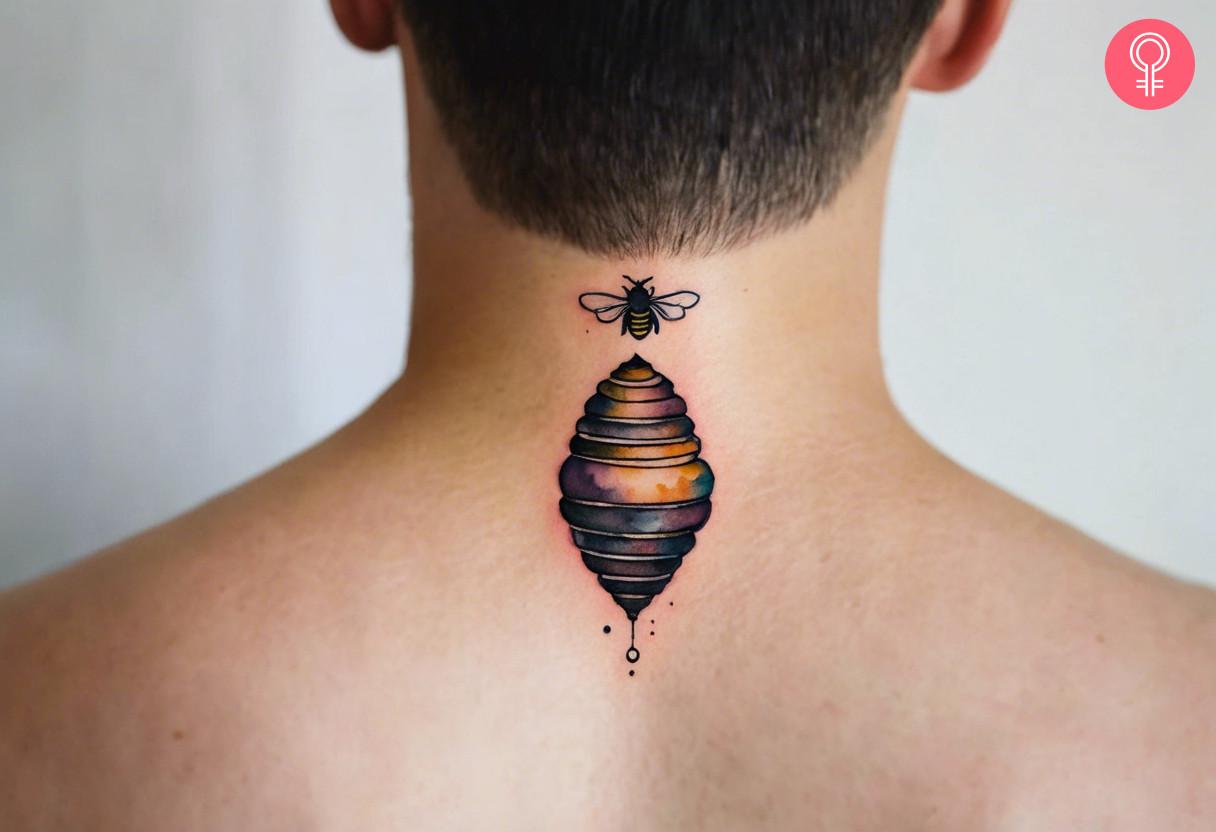 A traditional beehive tattoo on the neck of a man.jpg