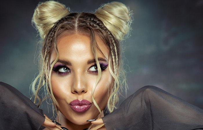 A woman flaunting space buns hairstyle.jpg
