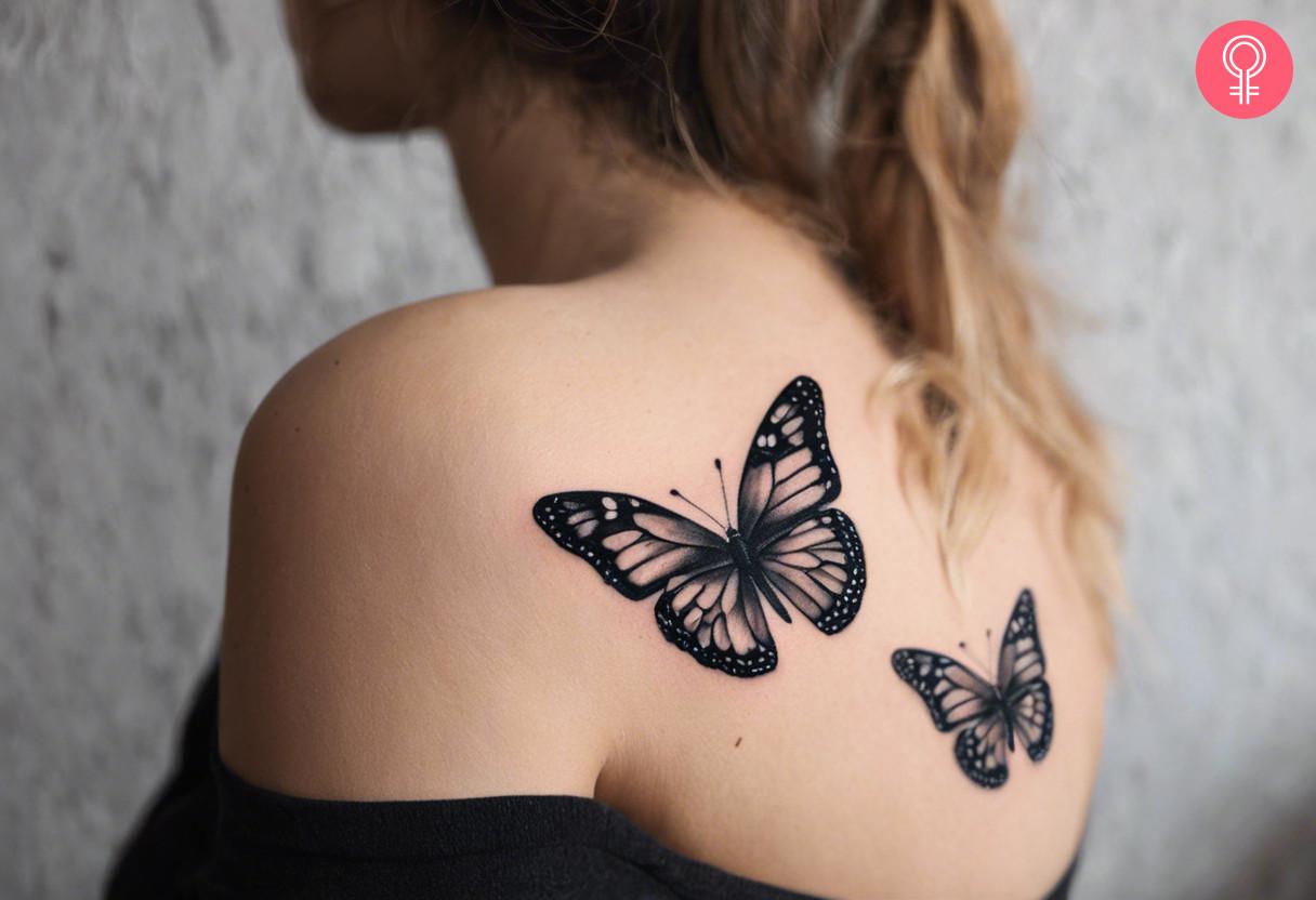 A woman wearing a butterfly shoulder tattoo on the back.jpg