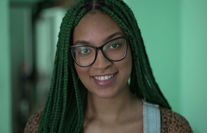 A woman with long green box braids hairstyle.jpg