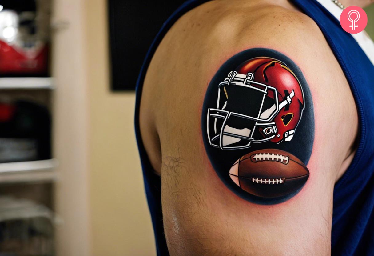 American football helmet and ball tattoo on a mans upper arm.jpg