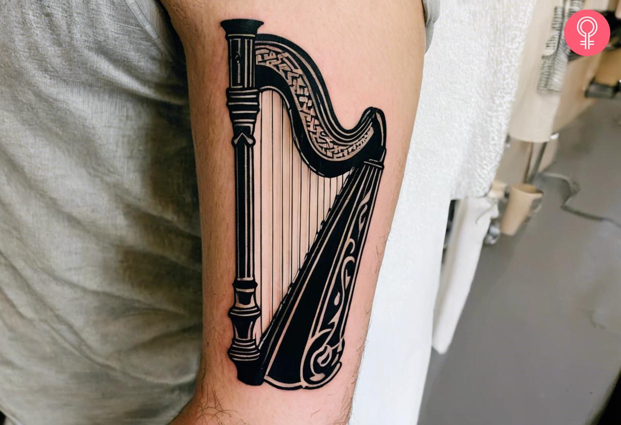 Irish harp tattoo on the arm.jpg