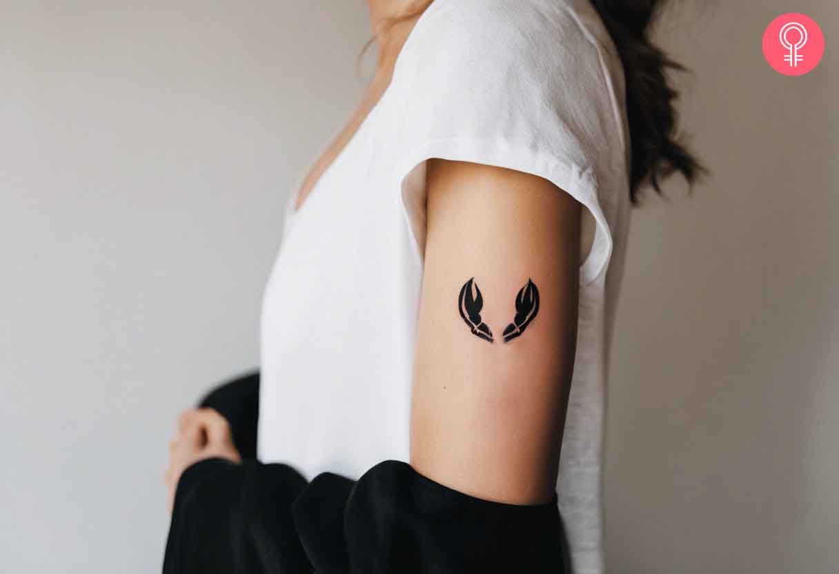 Lobster claws tattoo on the upper arm.jpg