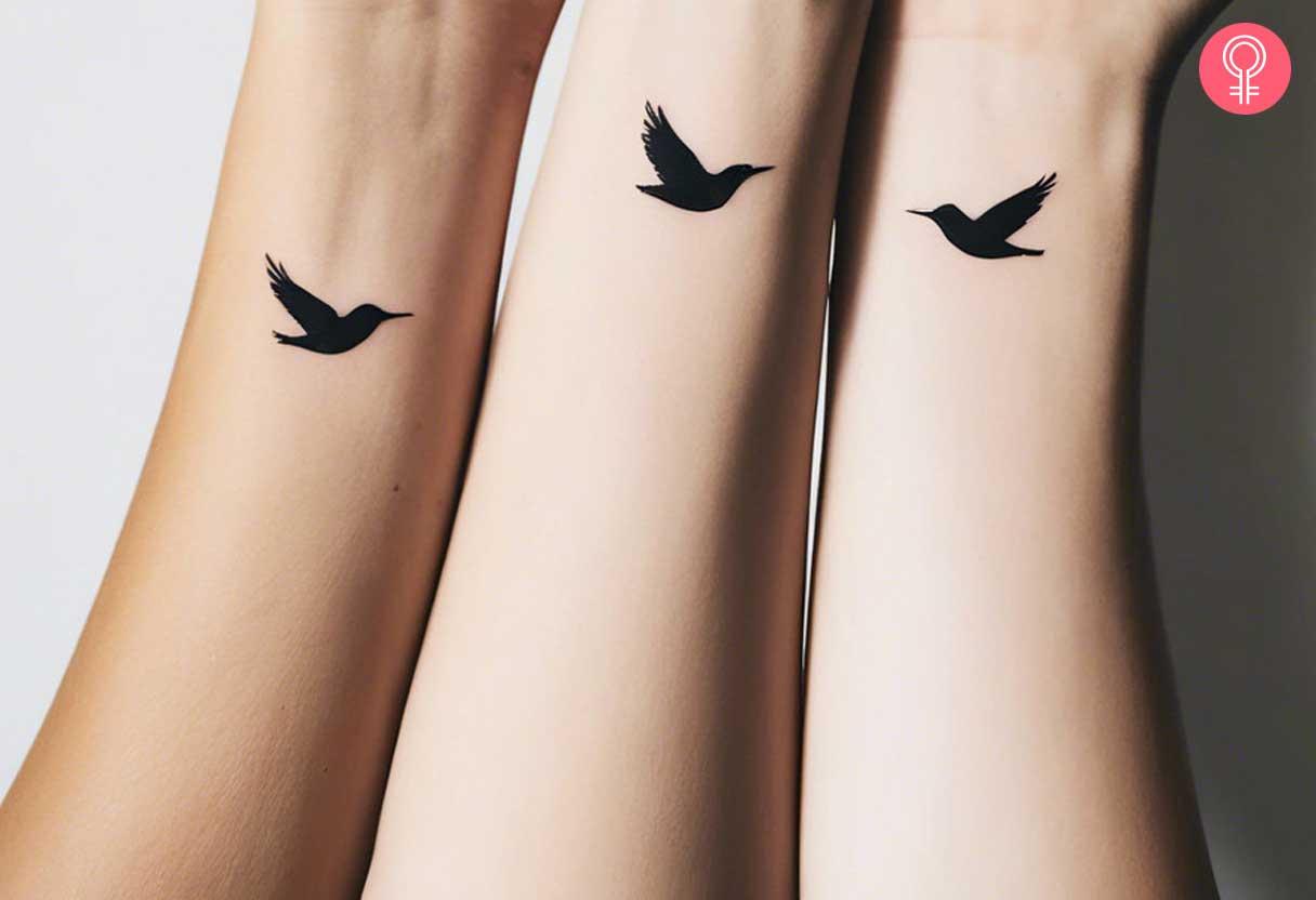 Minimalist black bird on wrist tattoo.jpg