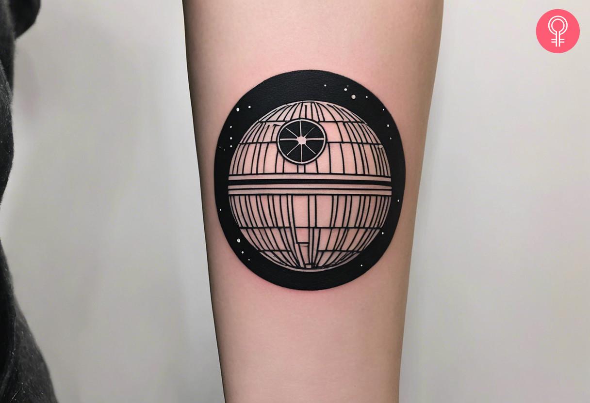 Minimalist death star tattoo on the forearm.jpg