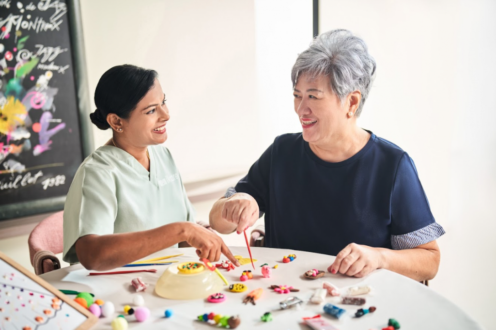 Official Image iKares care therapists demonstrating one of the cognitive activities 1024x681.png