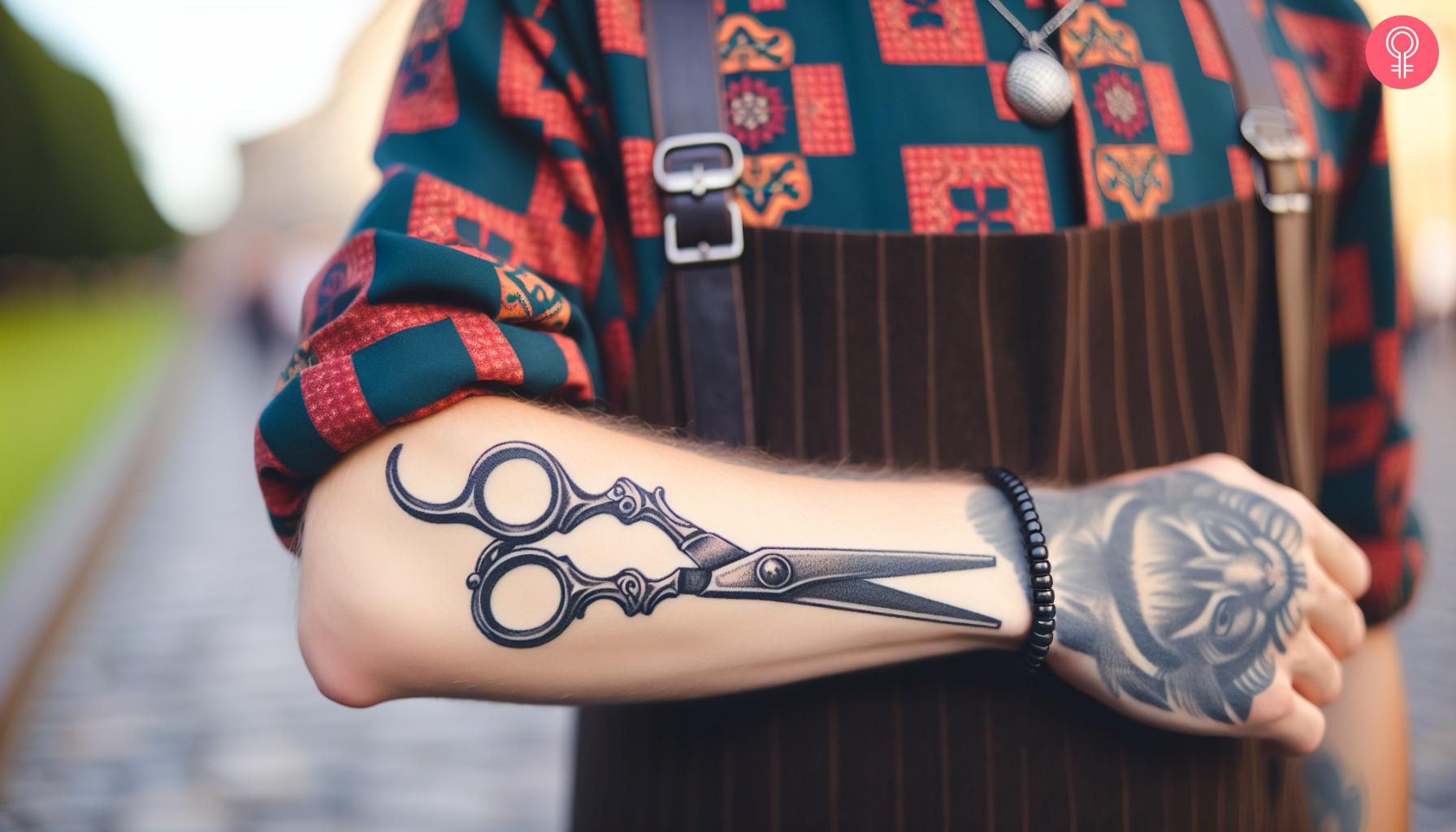 Woman with hairdresser scissors tattoo on her forearm.jpg