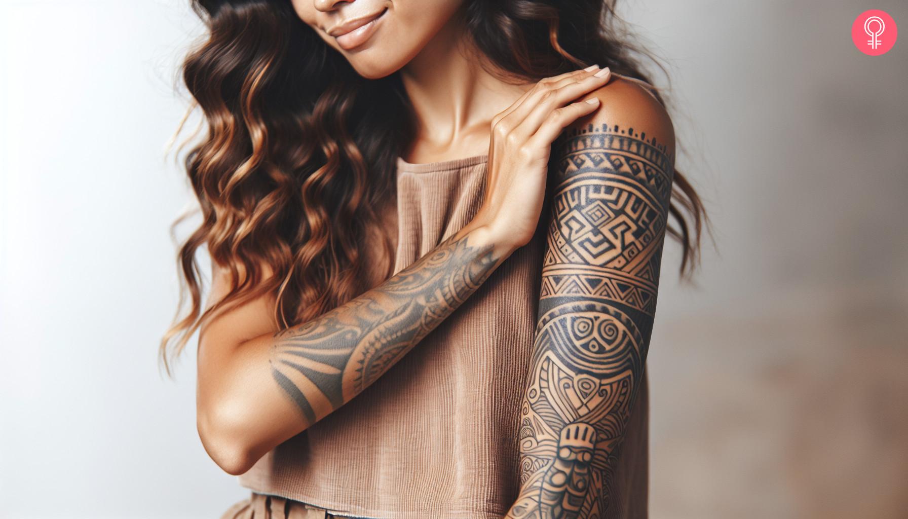 Woman with marquesan symbol tattoo on her arm.jpg