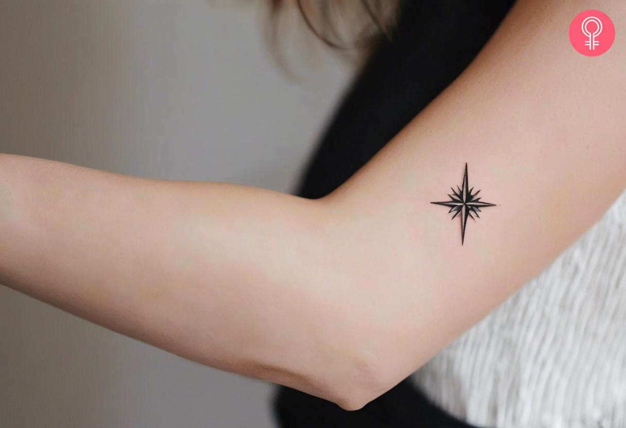 Woman with minimalist North Star tattoo on her arm.jpg