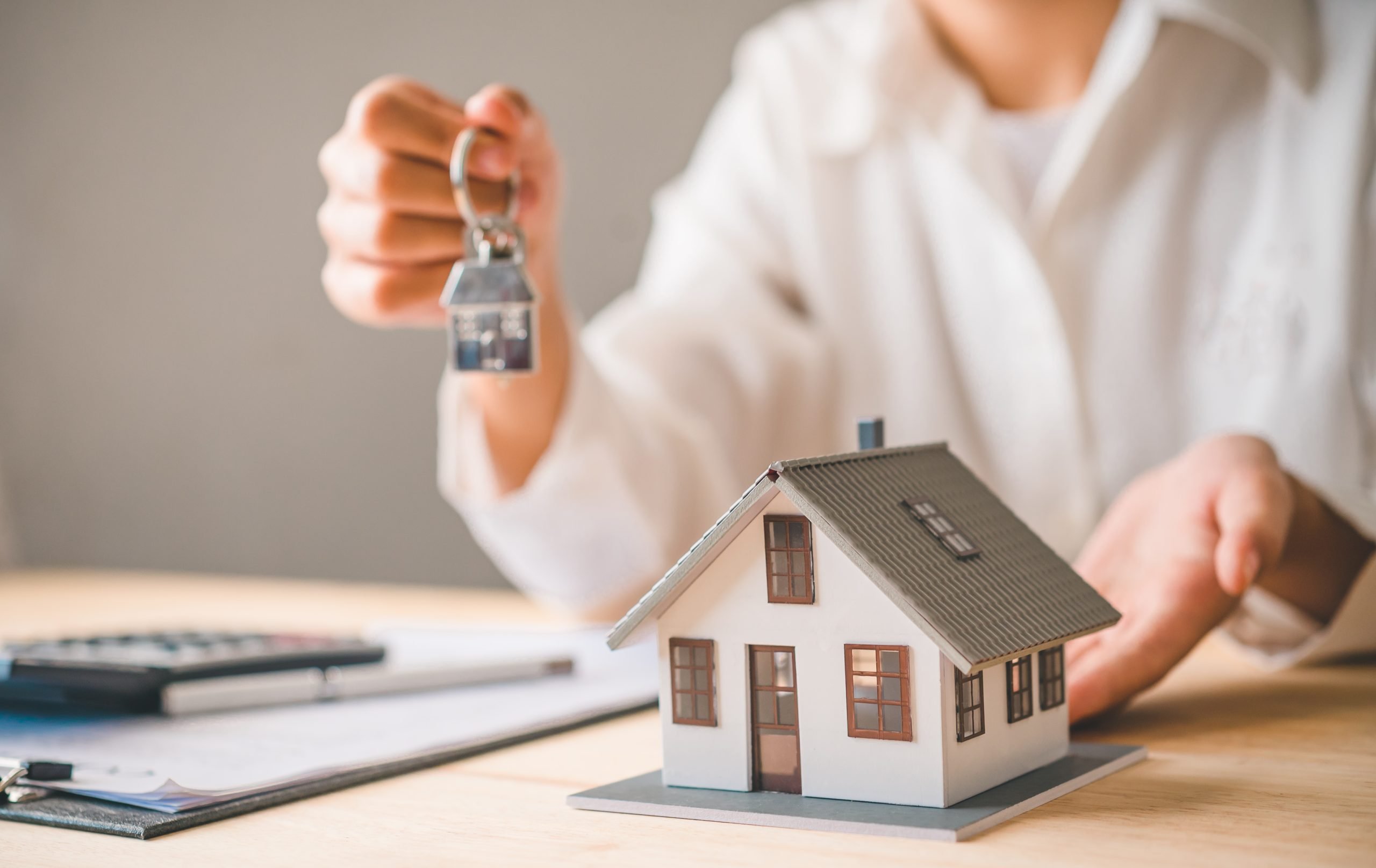 salesperson concept of holding house keys house k 2022 09 20 22 39 25 utc scaled