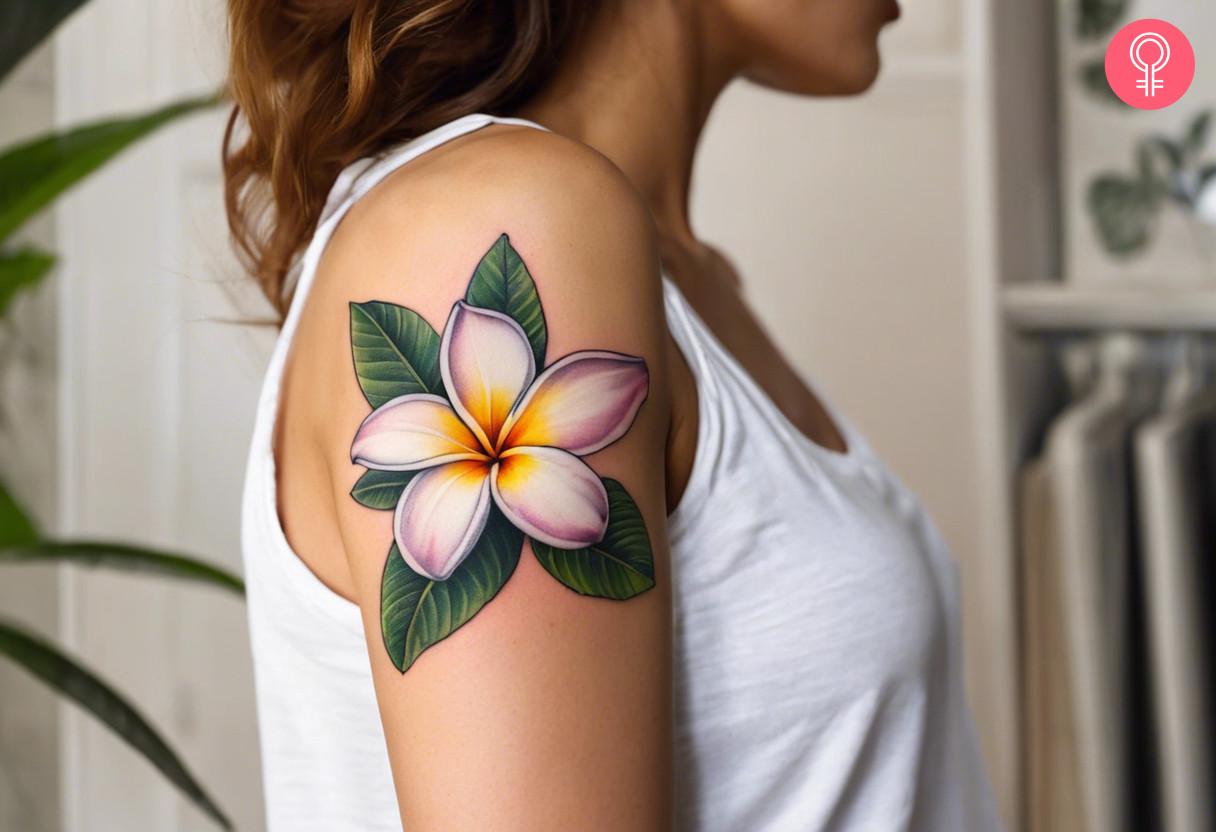 Plumeria Flower tattoo on the upper arm.jpg