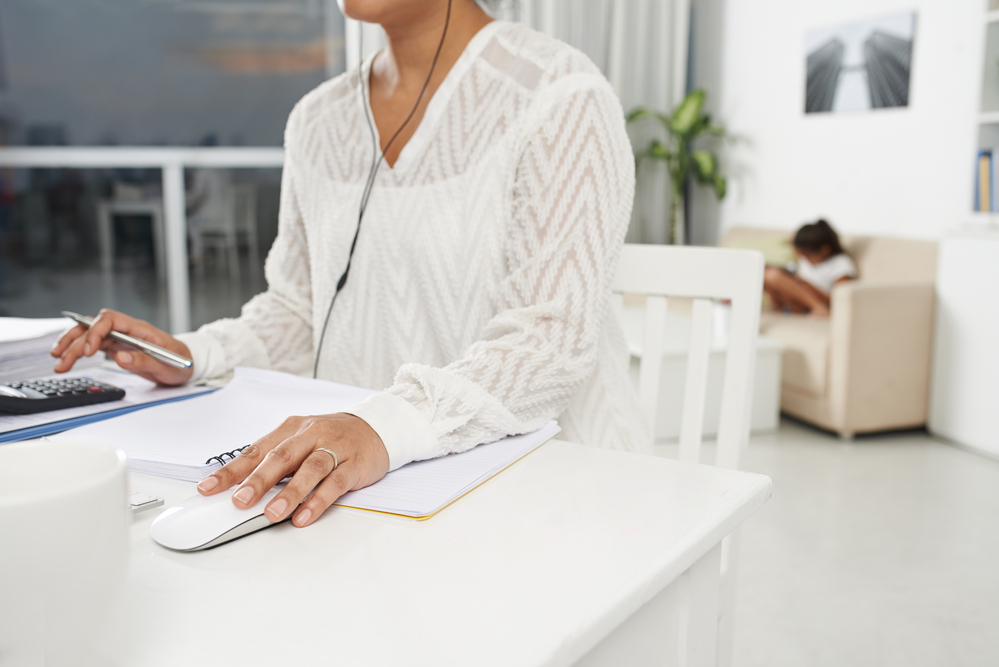 Female working from home as a remote receptionist.png
